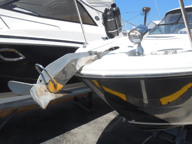 Slide: The Image of 2007 Sea Ray 290 Sundancer boat with anchor, docked in marina. - 25