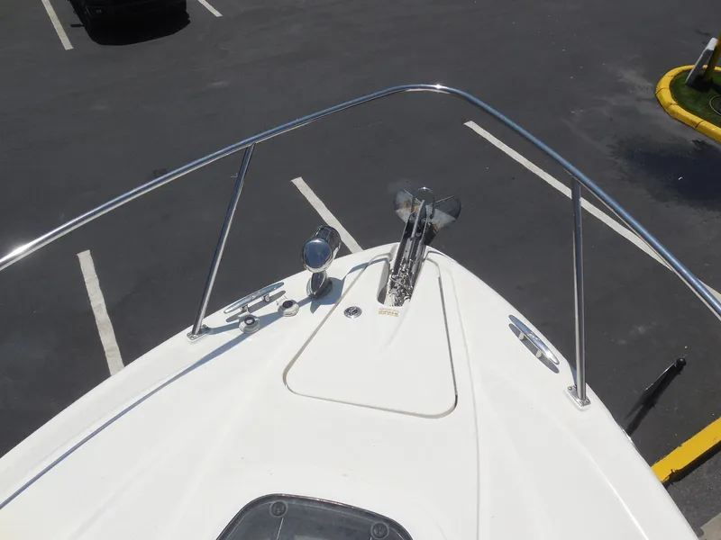 Slide: The Image of Bow of 2007 Sea Ray 290 Sundancer with anchor and railing in parking lot. - 29
