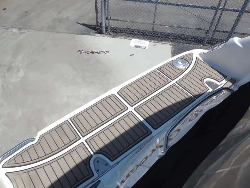 Slide: The Image of 2007 Sea Ray 290 Sundancer swim platform with teak-style decking. - 34