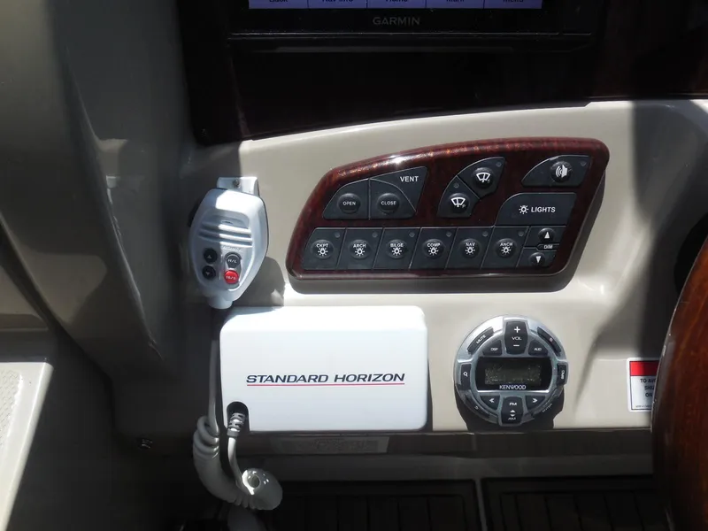 Slide: The Image of Control panel of a 2007 Sea Ray 290 Sundancer boat with navigation and communication equipment. - 48