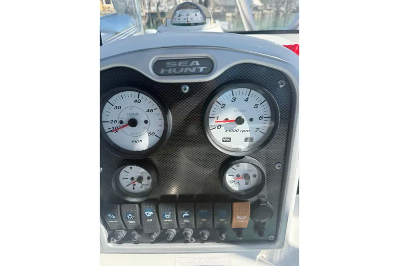 Slide: The Image of Dashboard of 2014 Sea Hunt Triton 220 boat with gauges and controls. - 10