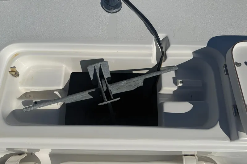 Slide: The Image of Anchor storage compartment on a 2014 Sea Hunt Triton 220 boat. - 24