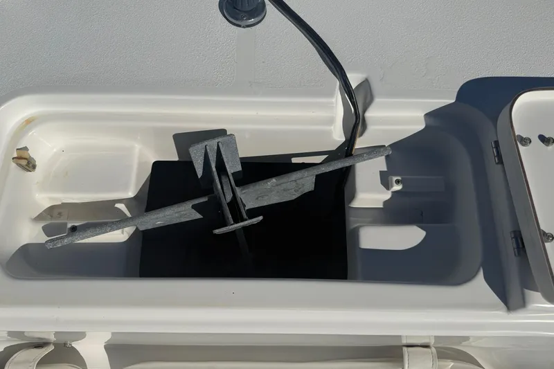 Slide: The Image of Anchor storage compartment on a 2014 Sea Hunt Triton 220 boat. - 25