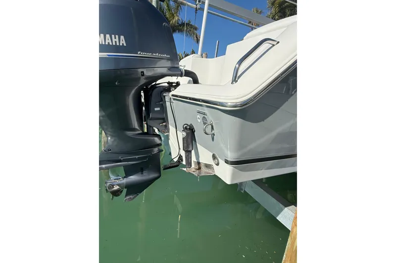 Slide: The Image of 2014 Sea Hunt Triton 220 boat with Yamaha outboard motor in water. - 36