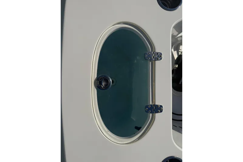 Slide: The Image of Livewell deck cover on a 2014 Sea Hunt Triton 220 boat. - 38