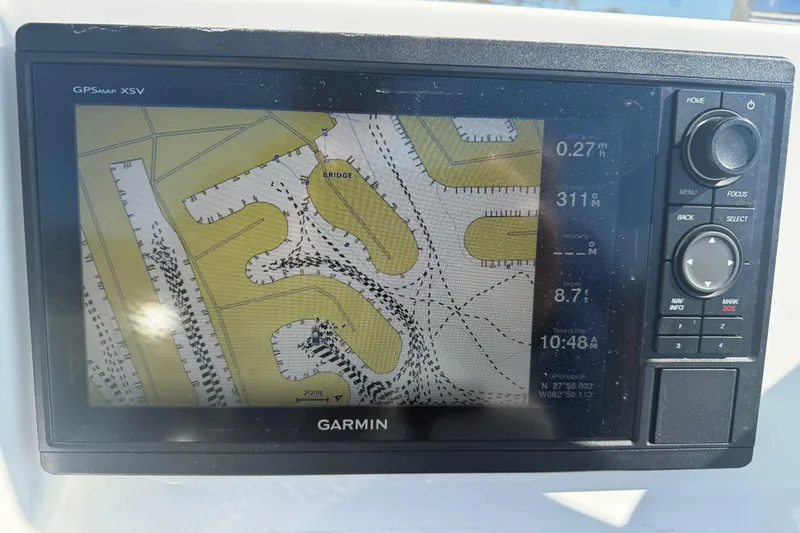 Slide: The Image of Garmin GPS display on 2014 Sea Hunt Triton 220 boat, showing navigational map. - 9