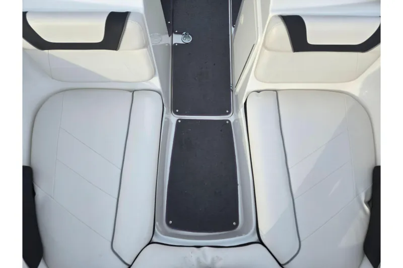 Slide: The Image of 2013 Yamaha Boats SX190 interior seating with white upholstery and black accents. - 18