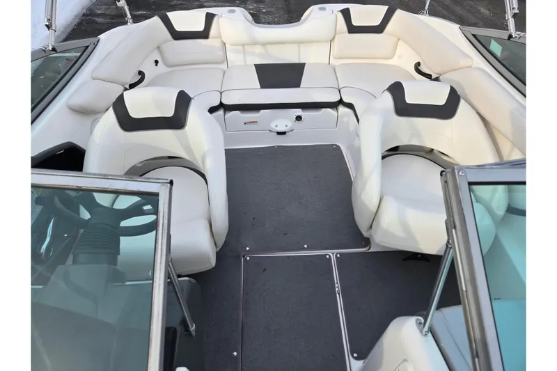 Slide: The Image of 2013 Yamaha Boats SX190 interior with white seating and steering wheel. - 20