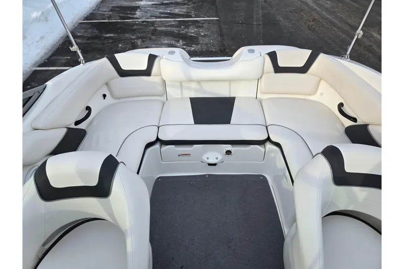 Slide: The Image of 2013 Yamaha Boats SX190 interior with white and black seating, spacious layout. - 21