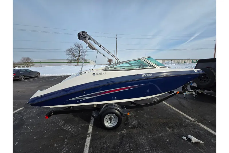 Slide: The Image of 2013 Yamaha Boats SX190 on trailer in snowy parking lot. - 4