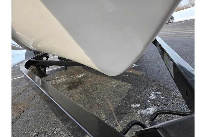 Slide: The Image of 2013 Yamaha Boats SX190 on trailer, close-up view of hull and frame. - 7