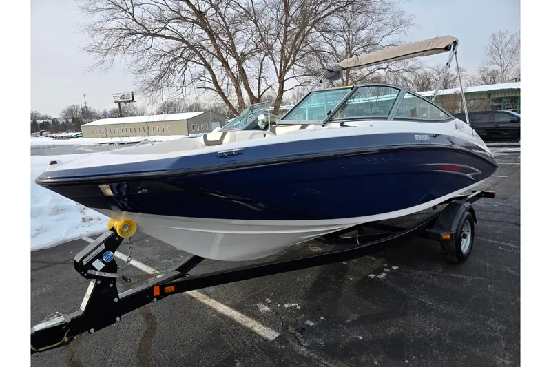 Slide: The Image of 2013 Yamaha Boats SX190 on trailer, parked in snowy lot. - 8