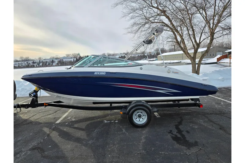 Slide: The Image of 2013 Yamaha Boats SX190 on trailer, parked in snowy landscape. - 9