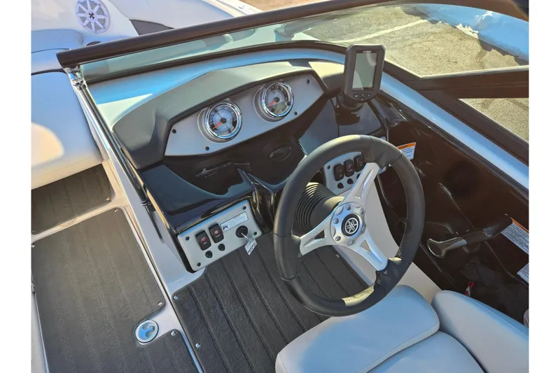 Slide: The Image of 2014 Yamaha Boats AR192 dashboard with steering wheel and instrument panel. - 11