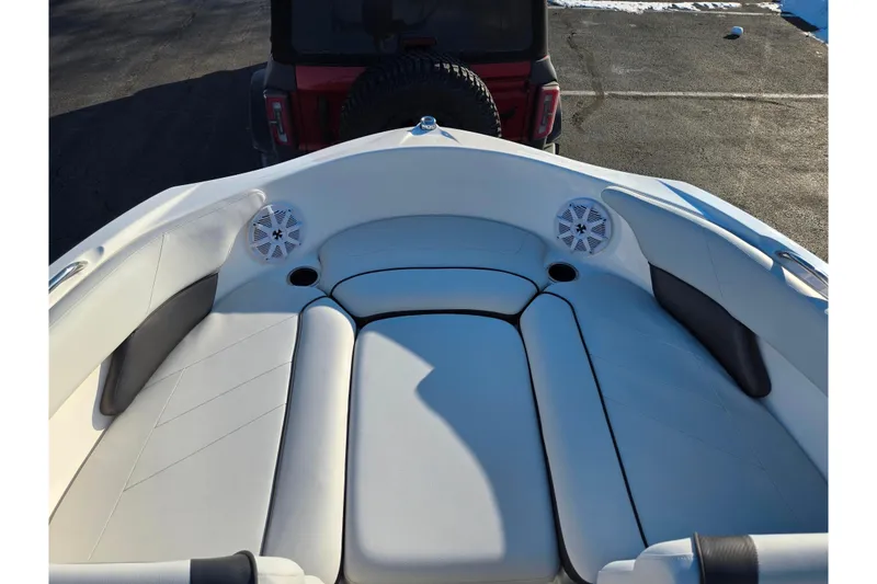 Slide: The Image of 2014 Yamaha Boats AR192 interior with white seating and speakers. - 16