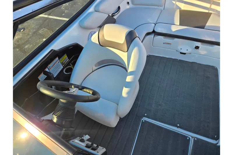Slide: The Image of 2014 Yamaha Boats AR192 interior with steering wheel and seating area. - 19