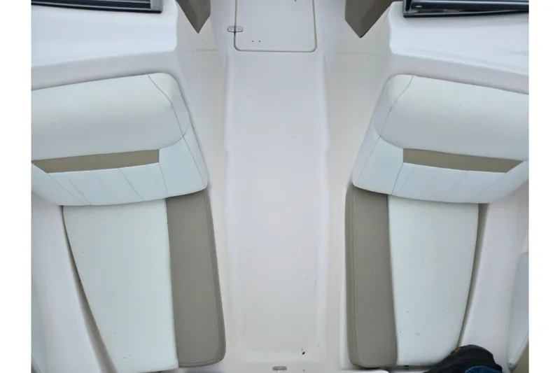 Slide: The Image of 2015 Regal 1900 ES Bowrider interior seating, white and beige upholstery. - 17