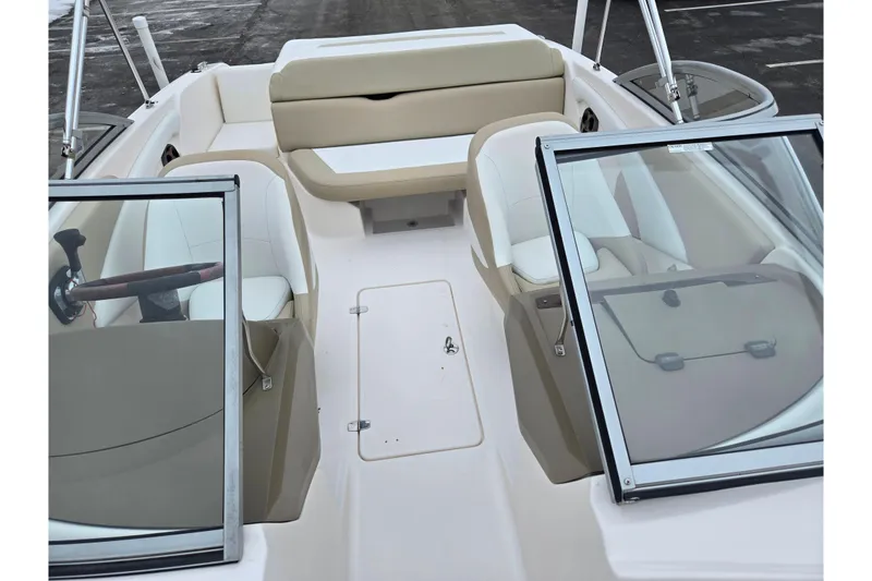 Slide: The Image of 2015 Regal 1900 ES Bowrider interior with beige and white seating, open windshield. - 18