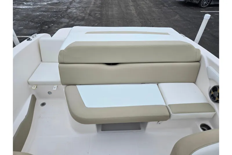 Slide: The Image of 2015 Regal 1900 ES Bowrider boat interior with beige and white seating. - 20