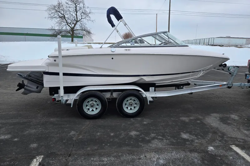 Slide: The Image of 2015 Regal 1900 ES Bowrider on trailer in snowy parking lot. - 4