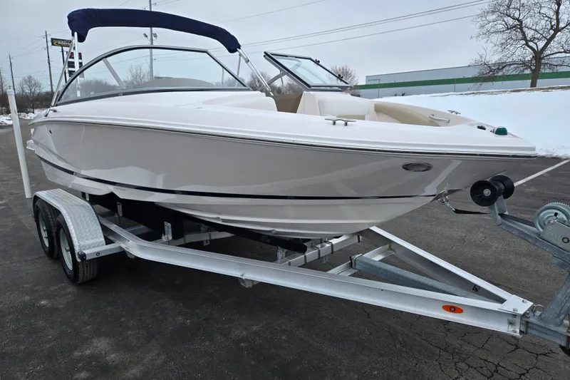 Slide: The Image of 2015 Regal 1900 ES Bowrider on trailer, parked on snowy pavement. - 5