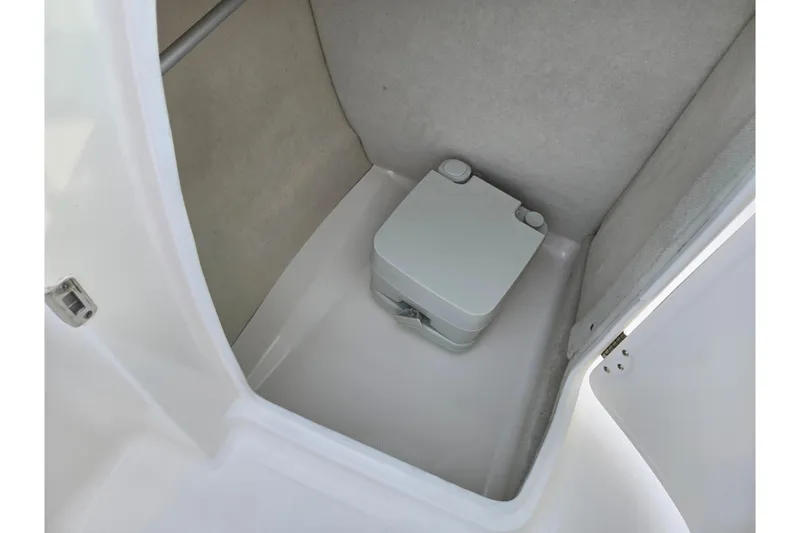Slide: The Image of 2016 Chaparral 210 Suncoast Ski & Fish boat interior with portable toilet. - 16