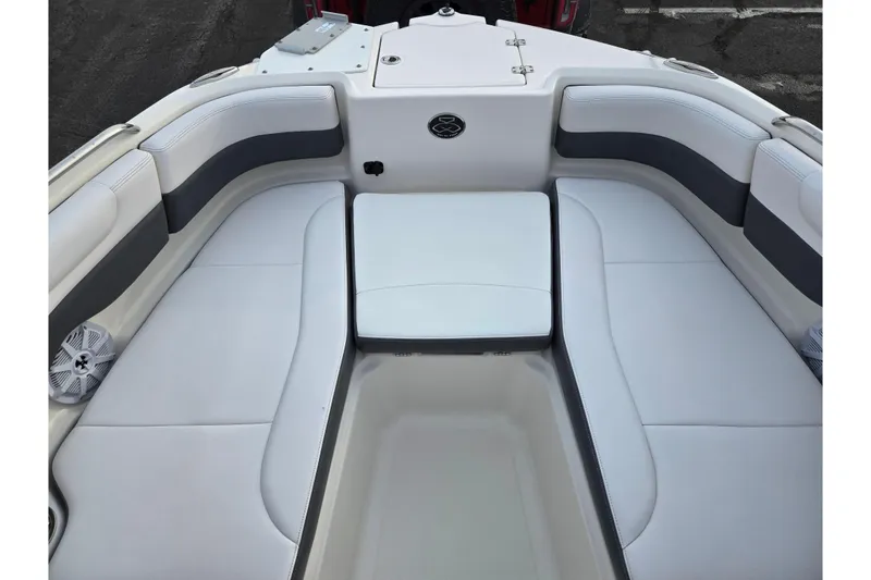 Slide: The Image of 2016 Chaparral 210 Suncoast Ski & Fish boat interior with cushioned seating. - 18