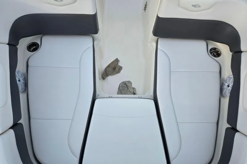 Slide: The Image of 2016 Chaparral 210 Suncoast Ski & Fish boat interior with white and gray seating. - 20