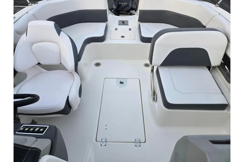 Slide: The Image of 2016 Chaparral 210 Suncoast Ski & Fish boat interior with white and gray seating. - 22