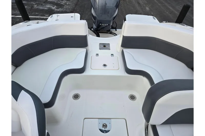Slide: The Image of 2016 Chaparral 210 Suncoast Ski & Fish boat interior with cushioned seating. - 23