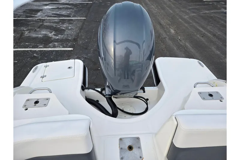 Slide: The Image of 2016 Chaparral 210 Suncoast Ski & Fish boat with outboard motor, rear view. - 24