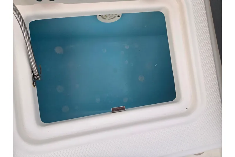 Slide: The Image of Livewell compartment in 2016 Chaparral 210 Suncoast Ski & Fish boat. - 25