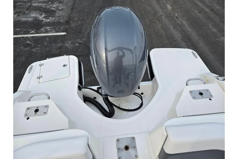 Slide: The Image of 2016 Chaparral 210 Suncoast Ski & Fish boat with outboard motor, rear view. - 26