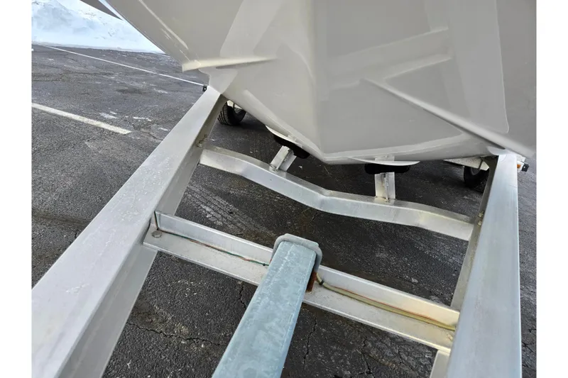 Slide: The Image of 2016 Chaparral 210 Suncoast Ski & Fish boat on trailer, close-up view. - 7