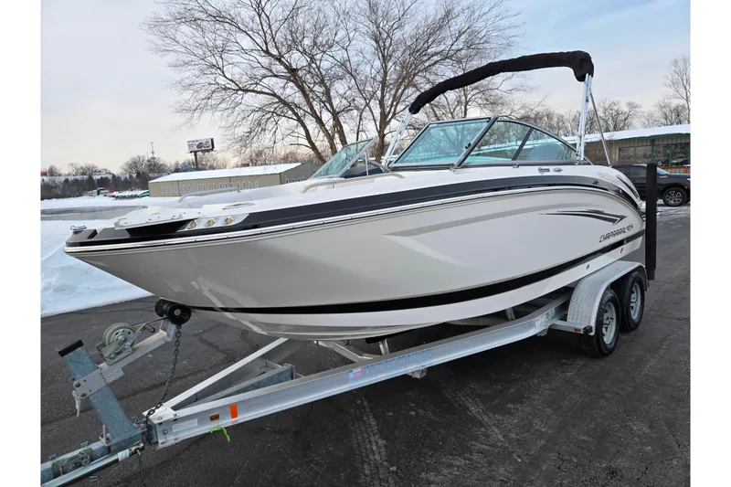 Slide: The Image of 2016 Chaparral 210 Suncoast Ski & Fish boat on trailer, parked outdoors. - 8