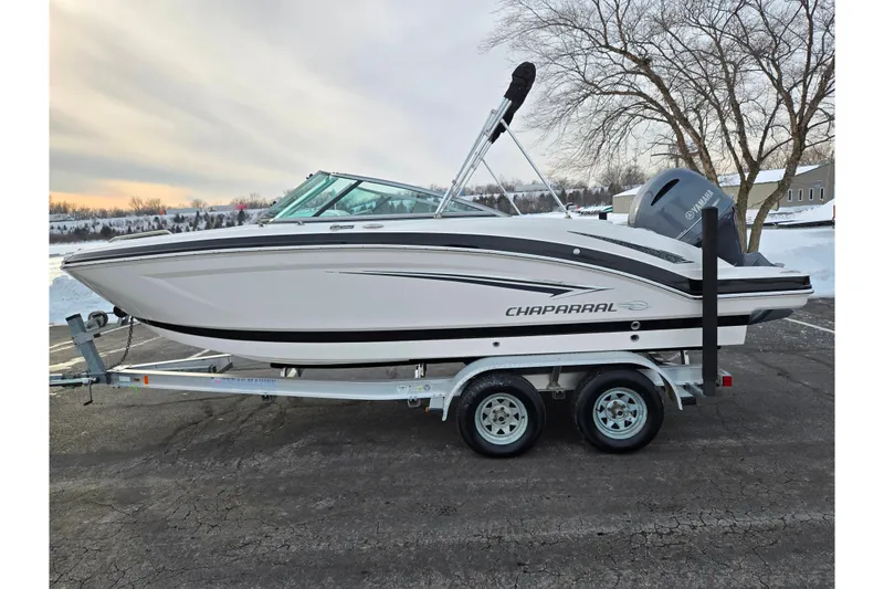 Slide: The Image of 2016 Chaparral 210 Suncoast Ski & Fish boat on trailer, parked outdoors. - 9