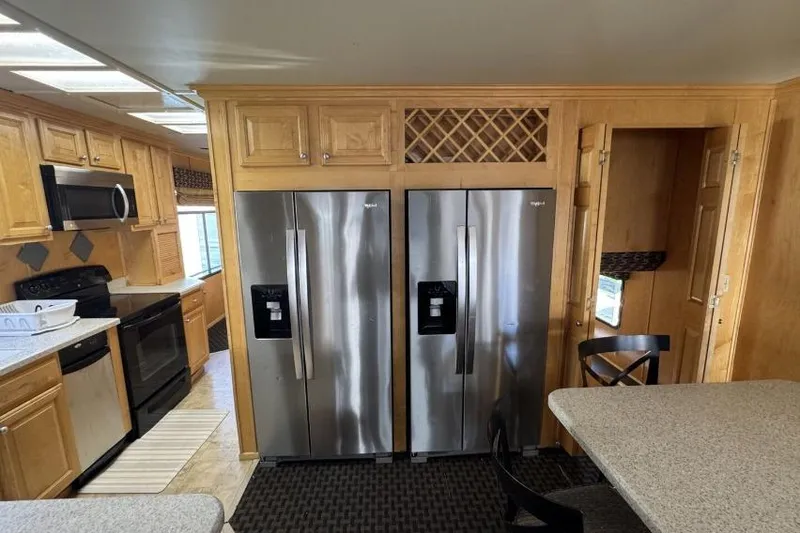 Slide: The Image of Modern kitchen in American Waterways' 2006 Desert Rain Trip# 8, featuring stainless steel appliances. - 16