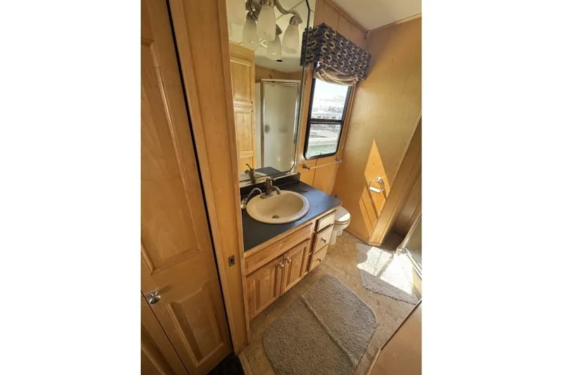 Slide: The Image of Compact bathroom in 2006 American Waterways Desert Rain Trip# 8, featuring sink, shower, and window. - 19