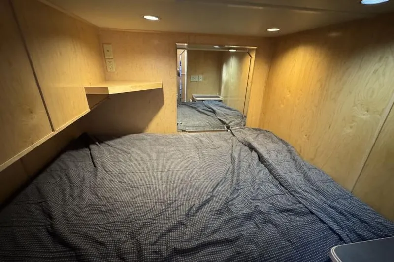 Slide: The Image of Compact cabin interior with wooden walls and a bed, from American Waterways' 2006 Desert Rain Trip. - 22