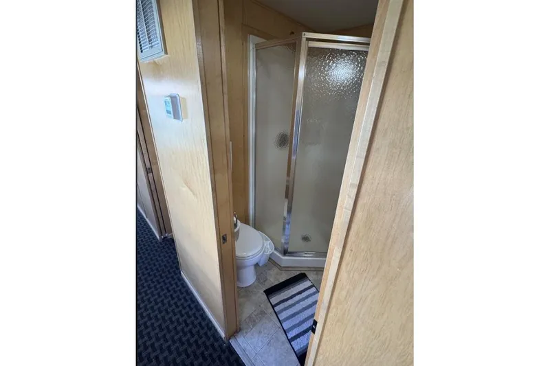 Slide: The Image of Compact bathroom with shower and toilet on American Waterways Desert Rain Trip, 2006. - 23