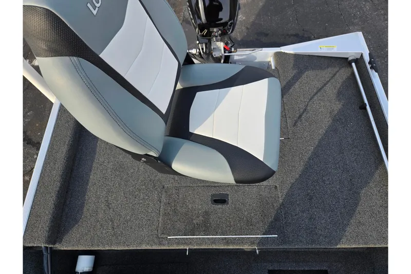 Slide: The Image of 2016 Lowe Skorpion boat seat with gray and white upholstery on carpeted deck. - 20