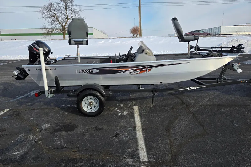 Slide: The Image of 2016 Lowe Skorpion boat on trailer in snowy parking lot. - 4
