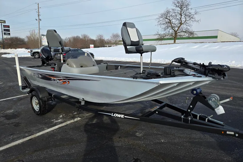 Slide: The Image of 2016 Lowe Skorpion fishing boat on trailer in snowy parking lot. - 5