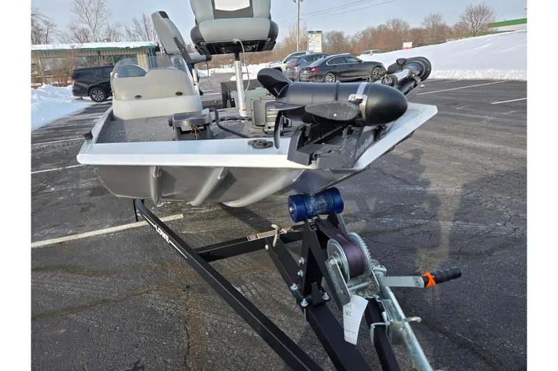 Slide: The Image of 2016 Lowe Skorpion boat on trailer in snowy parking lot. - 6