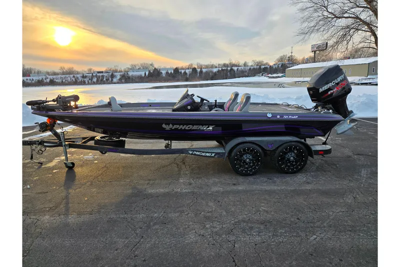 Slide: The Image of 2016 Phoenix 721 ProXP boat on trailer at sunset, snowy landscape in background. - 10