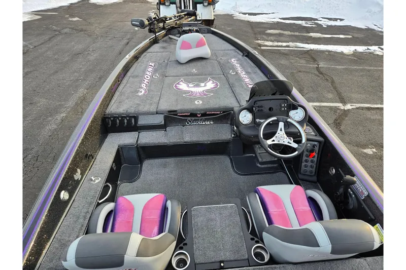 Slide: The Image of 2016 Phoenix 721 ProXP boat interior with dual seats and steering console. - 11