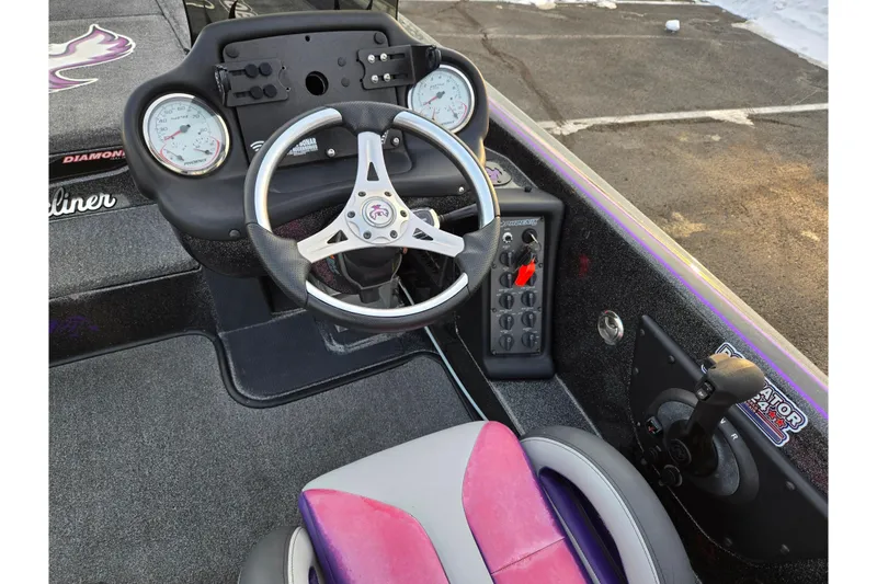 Slide: The Image of 2016 Phoenix 721 ProXP boat cockpit with steering wheel and control panel. - 12