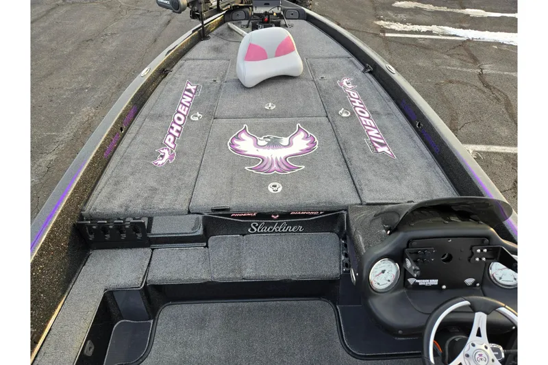 Slide: The Image of 2016 Phoenix 721 ProXP boat interior with custom graphics and steering console. - 14