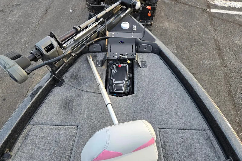 Slide: The Image of 2016 Phoenix 721 ProXP boat deck with trolling motor and storage compartment. - 16