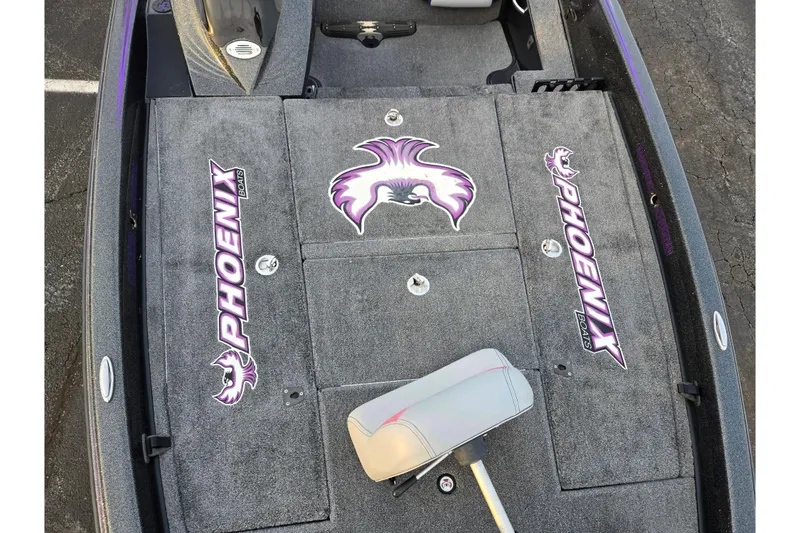 Slide: The Image of 2016 Phoenix 721 ProXP boat interior with branded carpet and seating. - 17